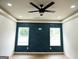 Bedroom with unique geometric accent wall and hardwood floors at 3299 Sims St, Hapeville, GA 30354