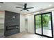 Living room with fireplace, built-in shelving, and access to deck at 3299 Sims St, Hapeville, GA 30354