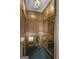 Inside of a private elevator with mirrored and wood-paneled walls at 115 Eagles Club Dr, Stockbridge, GA 30281