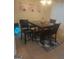 Dining area with table, chairs, and rug at 2237 Wind Rose Ct, Lithonia, GA 30058