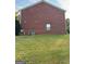 Red brick side of house, grassy area at 2237 Wind Rose Ct, Lithonia, GA 30058