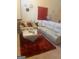 Living room with sectional sofa and rug at 2237 Wind Rose Ct, Lithonia, GA 30058