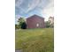 Brick building exterior with grassy yard at 2237 Wind Rose Ct, Lithonia, GA 30058
