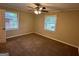 Bright bedroom with neutral walls, carpet flooring, and two windows at 2241 Sharon Way, Decatur, GA 30032