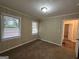 Cozy bedroom with neutral walls, carpet flooring, and two windows at 2241 Sharon Way, Decatur, GA 30032