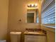 Clean bathroom with granite vanity and a window at 2241 Sharon Way, Decatur, GA 30032