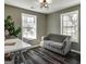 Bright office space with large windows and a comfortable gray couch at 2029 Detroit Nw Ave, Atlanta, GA 30314