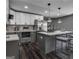 Modern kitchen with gray cabinets, white countertops, and a large island at 2029 Detroit Nw Ave, Atlanta, GA 30314
