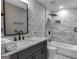 Modern bathroom with gray vanity, marble tile, and bathtub at 2029 Detroit Nw Ave, Atlanta, GA 30314