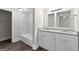 Elegant bathroom with granite double vanity and tiled shower/tub at 26 Pool Woods Dr, Grantville, GA 30220