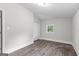 Spacious bedroom with wood-look floors and closet at 26 Pool Woods Dr, Grantville, GA 30220