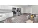 Updated kitchen with stainless steel appliances and granite countertops at 26 Pool Woods Dr, Grantville, GA 30220