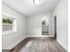 Bedroom with wood-look floors and bathroom access at 26 Pool Woods Dr, Grantville, GA 30220