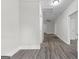 Bright hallway with gray vinyl plank flooring at 26 Pool Woods Dr, Grantville, GA 30220