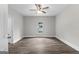 Bright bedroom with wood-look floors and a ceiling fan at 26 Pool Woods Dr, Grantville, GA 30220
