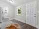 Hallway with wood-look floors and utility room access at 26 Pool Woods Dr, Grantville, GA 30220