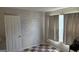 Bedroom with brick-patterned wallpaper and a window at 5204 Waldrop Pl, Decatur, GA 30034