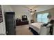 Main bedroom with dresser, TV, and ceiling fan at 5204 Waldrop Pl, Decatur, GA 30034