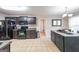 Modern kitchen with dark cabinetry, granite countertops, and stainless steel appliances at 200 Point Ridge Ct, Temple, GA 30179