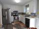 Kitchen with stainless steel appliances and white cabinets at 110 Gwenellen Dr, Locust Grove, GA 30248
