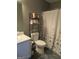 Bathroom with shower/tub and shelving unit at 110 Gwenellen Dr, Locust Grove, GA 30248