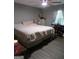 Bedroom with king-size bed and work area at 110 Gwenellen Dr, Locust Grove, GA 30248