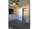 Bedroom with ceiling fan, carpet, and window at 10100 Silent Trl, Jonesboro, GA 30238