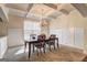 Dining room with coffered ceiling, chandelier, and large window at 1263 Polk Xing, Mcdonough, GA 30252