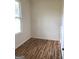 Bright bedroom with hardwood floors and large window at 4330 Cedar Valley Ln, Conley, GA 30288