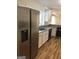 Stainless steel refrigerator in a kitchen with granite countertops at 4330 Cedar Valley Ln, Conley, GA 30288