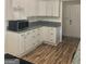 Modern kitchen with white cabinets and granite countertops at 4330 Cedar Valley Ln, Conley, GA 30288