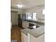 Modern kitchen with white cabinets and granite countertops at 4330 Cedar Valley Ln, Conley, GA 30288
