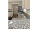 Granite countertop kitchen with white cabinets and a sink at 4330 Cedar Valley Ln, Conley, GA 30288