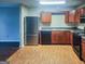 Well-lit kitchen with wood cabinets and stainless steel appliances at 675 Georgetown Ct, Jonesboro, GA 30236