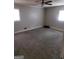 Well-lit bedroom with ceiling fan and gray carpet at 1999 Lindsey Ln, Decatur, GA 30035