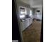 Kitchen features white cabinets and tile floor at 1999 Lindsey Ln, Decatur, GA 30035