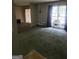 Spacious living room with large windows and gray carpet at 1999 Lindsey Ln, Decatur, GA 30035