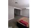 Large main bedroom with carpet and access to another room at 1999 Lindsey Ln, Decatur, GA 30035