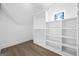 Large closet with built-in shelving and hanging rods at 5872 Dolvin Ln, Buford, GA 30518