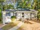 Ranch style home with white siding, attached garage, and a covered front porch at 9091 Raven Dr, Jonesboro, GA 30238