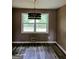 Dining room with wood-look flooring and a chandelier at 4139 Northstrand Dr, Decatur, GA 30035