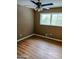 Spacious bedroom with wood-look flooring and ceiling fan at 4139 Northstrand Dr, Decatur, GA 30035