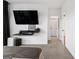 Bedroom with mounted TV, and access to bathroom and closet at 395 Pratt Se Dr # 802, Atlanta, GA 30315