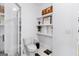 Clean bathroom with white toilet, chevron shower, and floating shelves at 395 Pratt Se Dr # 802, Atlanta, GA 30315