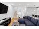 Open living space showcasing a sectional sofa, stairs, and kitchen view at 395 Pratt Se Dr # 802, Atlanta, GA 30315
