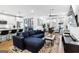 Open living room with sectional sofa, coffee table, and large TV at 395 Pratt Se Dr # 802, Atlanta, GA 30315