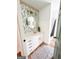 Modern bathroom with updated vanity, patterned wallpaper, and a walk-in shower at 45 Carroll Ln, Temple, GA 30179