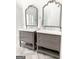 Elegant bathroom with double vanities and arched mirrors at 45 Carroll Ln, Temple, GA 30179