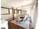 Bright dining room features a large wooden table with seating for eight and a chandelier at 45 Carroll Ln, Temple, GA 30179