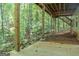 Concrete patio under deck, wooded view at 5447 Centry Dr, Villa Rica, GA 30180